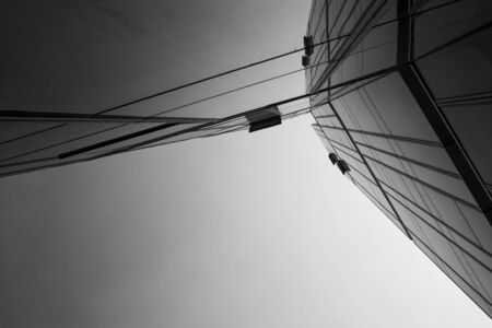 Bottom view of modern office building. Black and white picture.のeditorial素材