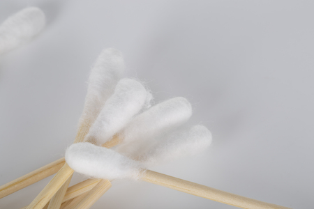Cotton swabs over a white background. Top view.の写真素材