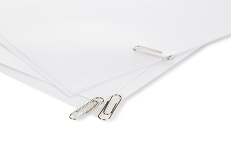 Beautiful shot of paper clip and blank paper isolated on the white background.
