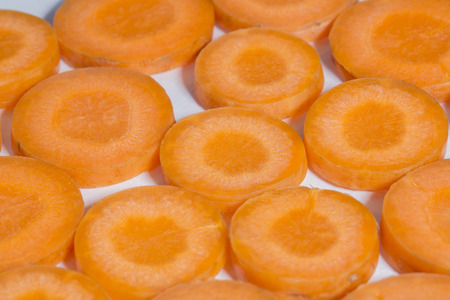 Healthy natural food, background. Carrots slices.の写真素材