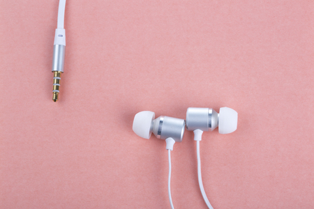 Earphone isolated on a pink background.の写真素材