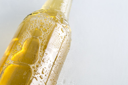 Closeup of cold beer on the white background.の写真素材