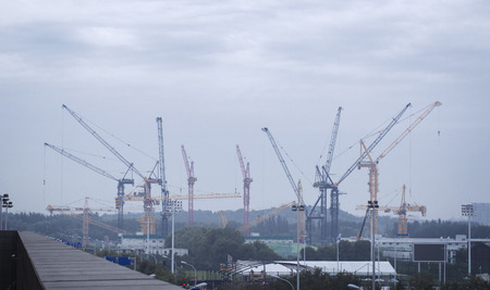 Construction cranes and sky background.の写真素材