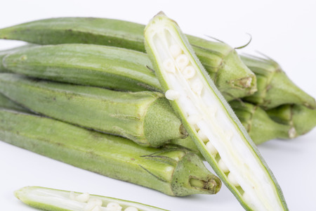 Closeup of okra on a white background.