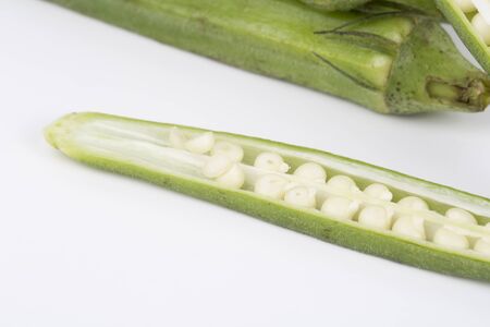 Closeup of okra on a white background.の写真素材