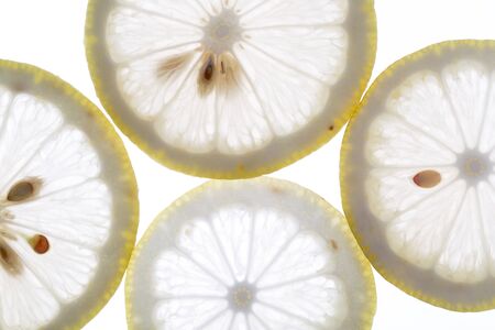 Fresh lemon slices on the white background.の写真素材