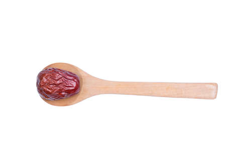 Chinese red date on a wooden spoon.の写真素材