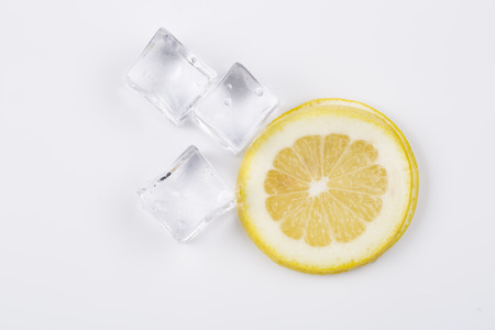 Ice cubes and lemon slices on white background.の写真素材