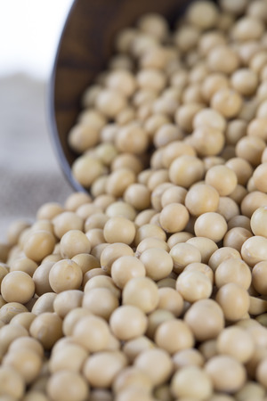 Soy beans and wooden bowl.の写真素材