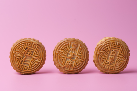 Mooncake on the pink background. Chinese traditional food.の写真素材
