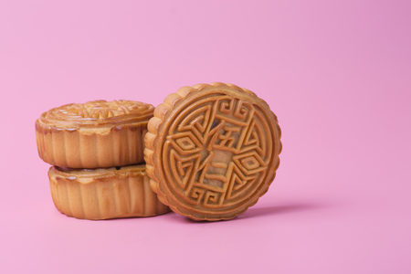 Mooncake on the pink background. Chinese traditional food.の写真素材
