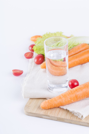 Healthy eating and drinking concept with vegetables on white backgroundの写真素材