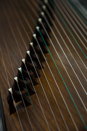 Gu Zheng. The gu Zheng is a traditional Chinese musical instrument. It belongs to the zither family of string instruments.の写真素材