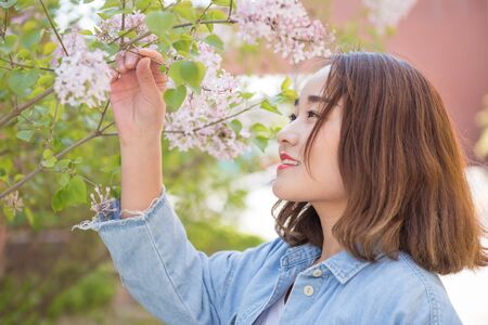 Young woman and flowersの写真素材