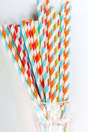 Striped paper straws in a glassの写真素材