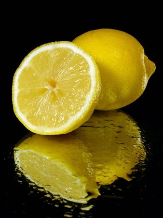 lemon on the black background with water drops   の写真素材