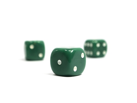 Three green dices on a white background   の写真素材