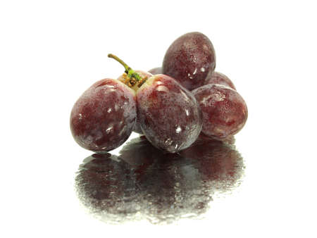 red grape on a white background with water drops の写真素材