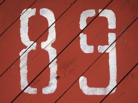 number 89 painted on a colored wood texture background pattern 