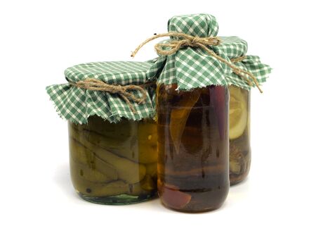 bottle of chilli oil, pickled paprika and cucumber on white background   の写真素材