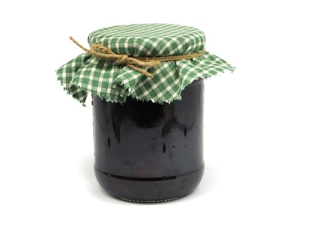 glass of plum jam on a white backgroundの写真素材