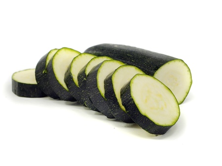 green zucchini slices on a white background water dropsの写真素材