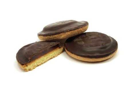 Cookies covered with chocolate and filled with jam on white background 
の写真素材