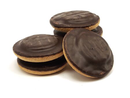 Cookies covered with chocolate and filled with jam on white background 
の写真素材