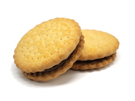  sandwich biscuits with chocolate filling on a white background 
の写真素材