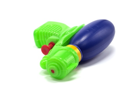 plastic water gun on a white backgroundの写真素材