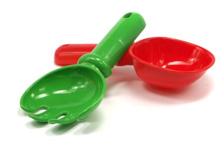 red toy rakeon and shovel on a white background 
の写真素材