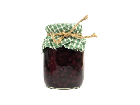 strawberry jam in glass jar on white background 
の写真素材