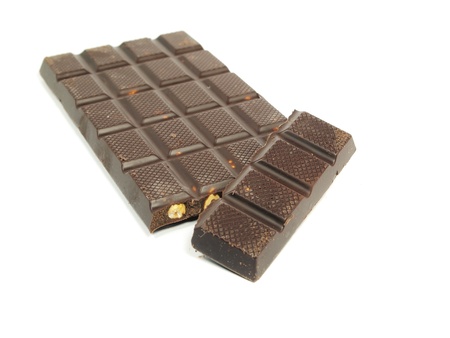 Chocolate bar with hazelnut on a white background    の写真素材