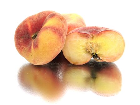 Exotic flat peach on a white background with water drop
の写真素材
