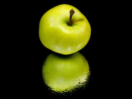 organic apple on a black background with water drops 
の写真素材