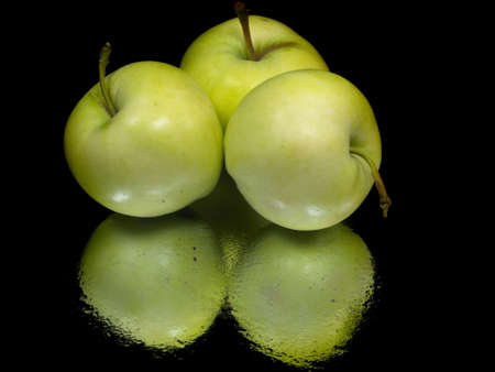 organic apple on a black background with water drops 
の写真素材