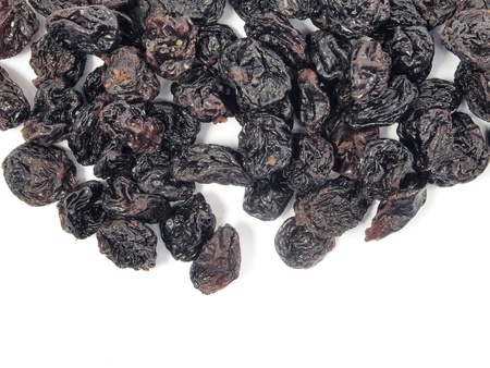 black raisins on a white background    の写真素材