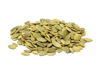 pumpkin seeds on a white backgroundの写真素材