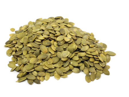 pumpkin seeds on a white backgroundの写真素材