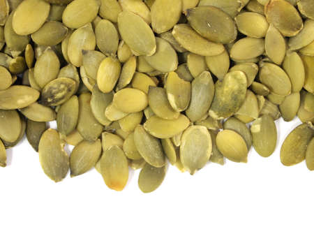 pumpkin seeds on a white backgroundの写真素材