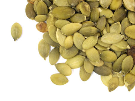 pumpkin seeds on a white backgroundの写真素材