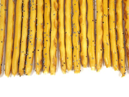 sweet crispy straw with poppy seeds on a white background 
      の写真素材