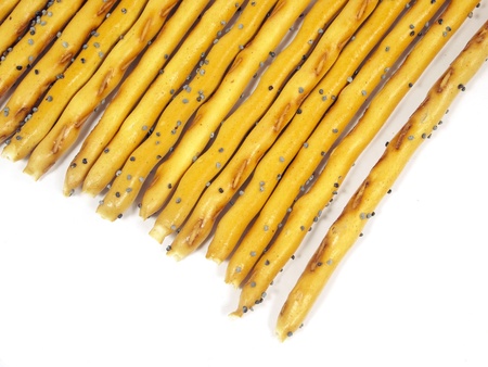 sweet crispy straw with poppy seeds on a white background 
      の写真素材