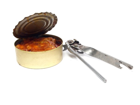 canned fish in tomato sauce with old can opener on a white background
      の写真素材