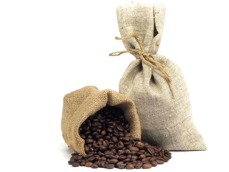 Coffee beans roasted in sack on a white backgroundの写真素材