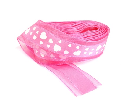 pink ribbon bow with white hearts on white background 
の写真素材