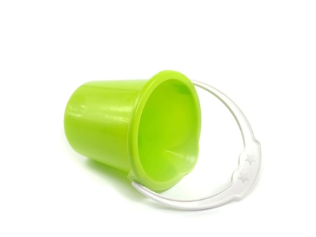 sand toy - green pail on a white backgroundの写真素材