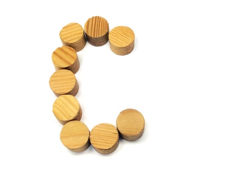 wood building blocks letter C on a white background の写真素材