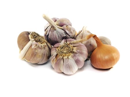 onion and garlic bulbs on a white background の写真素材
