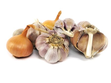 onion and garlic bulbs on a white background の写真素材